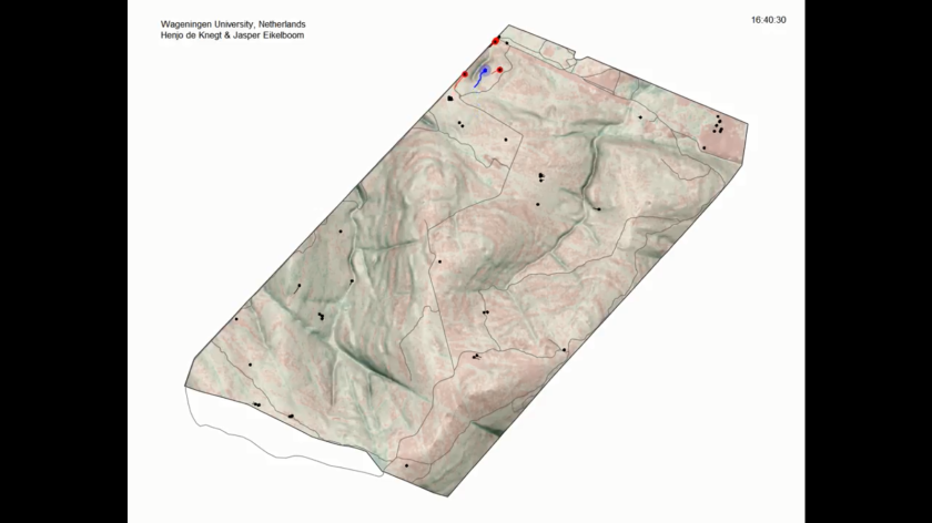 Screenshot of an animation that demonstrates our classification algorithm for the detection of fleeing animals. The screenshot displays the fenced area in Welgevonden Game Reserve (South Africa) with a ranger pretending to be a poacher (blue), undisturbed animals (black), and classified fleeing animals (red).